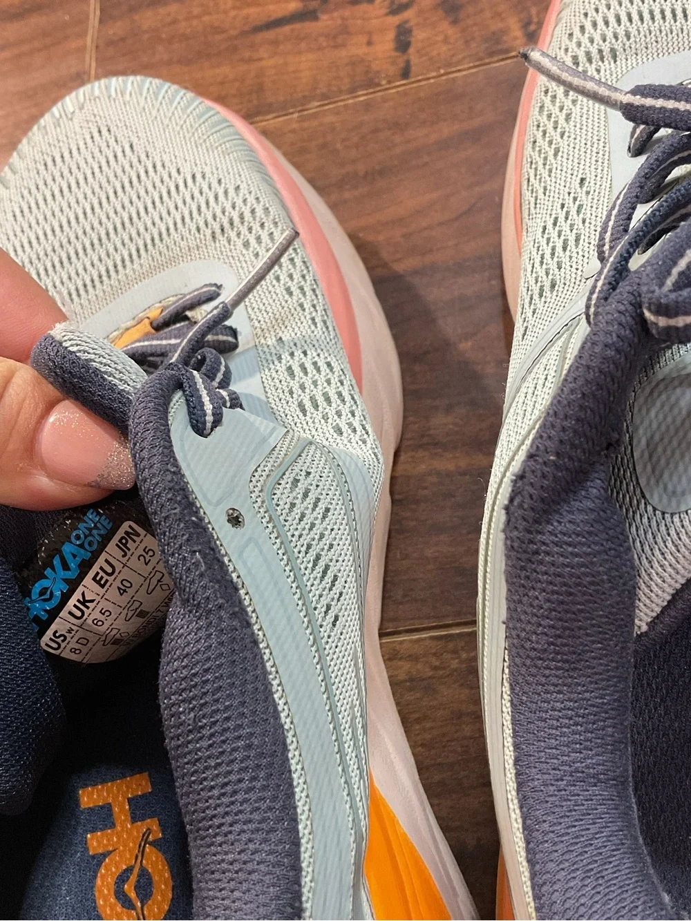 Hoka Blue Athletic Shoes with Orange and Pink Accents